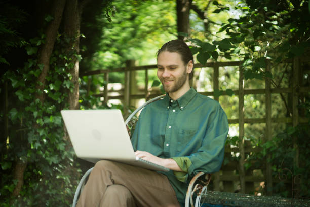 istock Working garden laptop man happy 1224385762