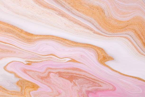 istock Fluid art texture. Backdrop with abstract iridescent paint effect. Liquid acrylic picture that flows and splashes. Mixed paints for background or poster. Golden, pink and white overflowing colors. 1224385765
