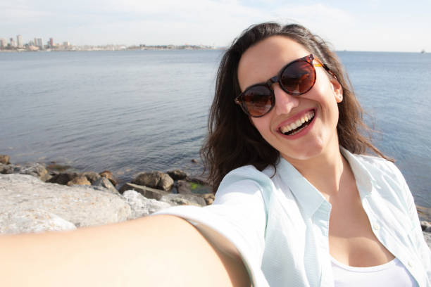 istock Smiling woman taking a selfie 1224386941