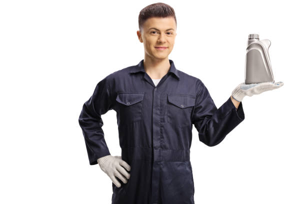 istock Young mechanic holding an engine oil plastic bottle 1224386967