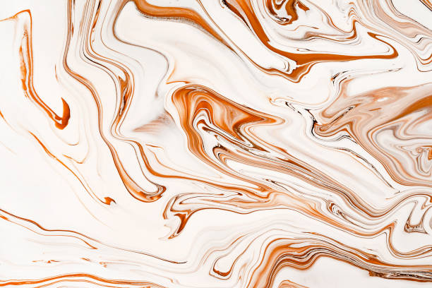 istock Flowing caramel raster background. Abstract brown and white mixed colors. 1224388206