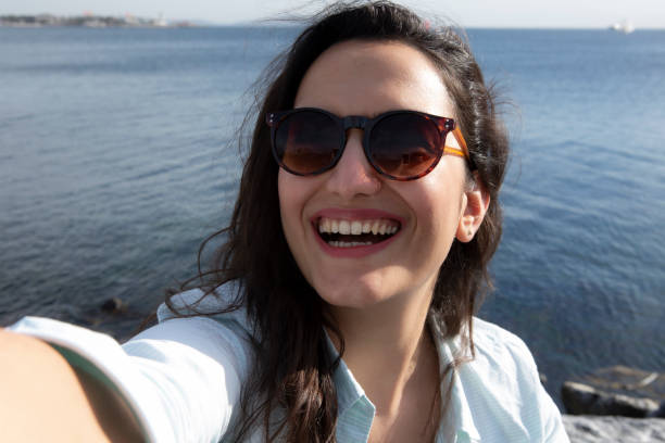 istock Smiling woman taking a selfie 1224388437