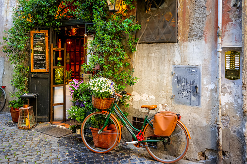 Rome, Italy, April 27 -- The entrance of a typical small restaurant in the ancient Trastevere district, the most loved and visited roman district by the tourists of the ethereal city.