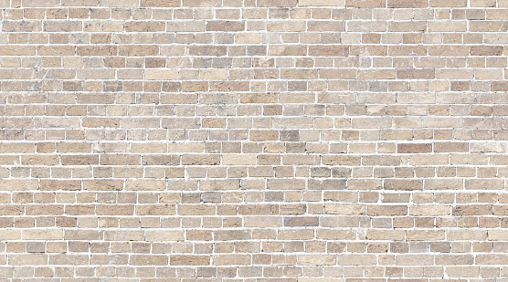 Textura sin costuras de la pared de ladrillo. Fondo de patrón de piedra beige photo