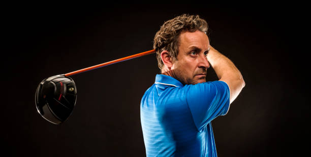istock Close up Golfer is driving golf ball to green course 1224390531