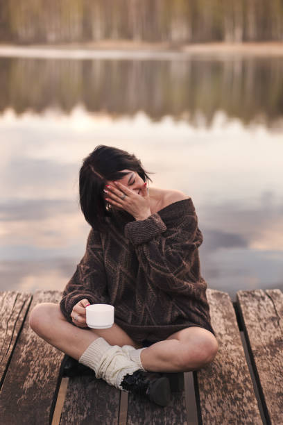 istock young girl drinks coffee outdoors emotions 1224390938