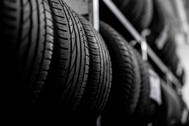 istock tire change - mechanic - tread service and control 1224392809