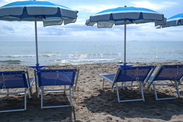 istock by the sea, beach, sunbeds and umbrellas 1224393280