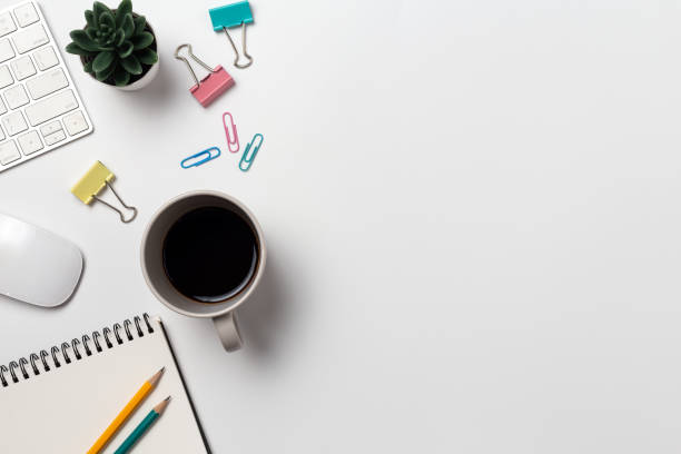 istock Top view, Workspace desk With coffee and office supplies on white background 1224395362