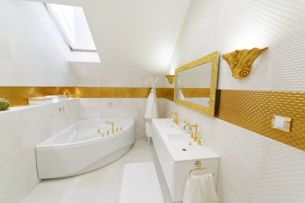 istock White bathroom with gold trim. Corner bathroom, chic mirror with washbasin. 1224398528