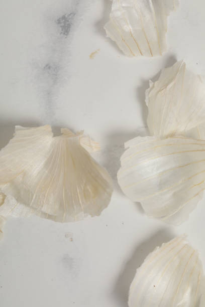 istock garlic peeling isolated on white background. Healthy food 1224399868