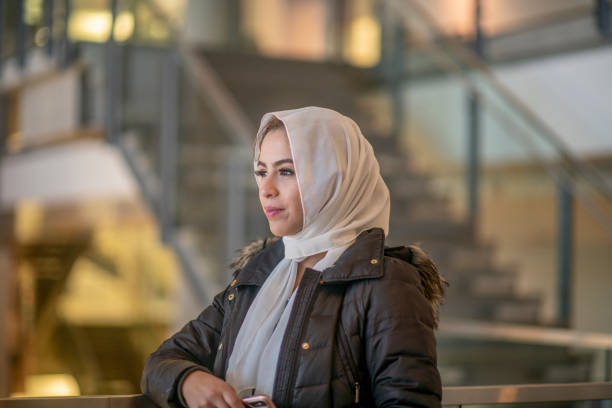 Islamic woman in hijab walking around the city.