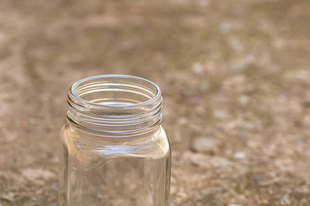 istock Close up of empty glass jar isolated. 1224401610