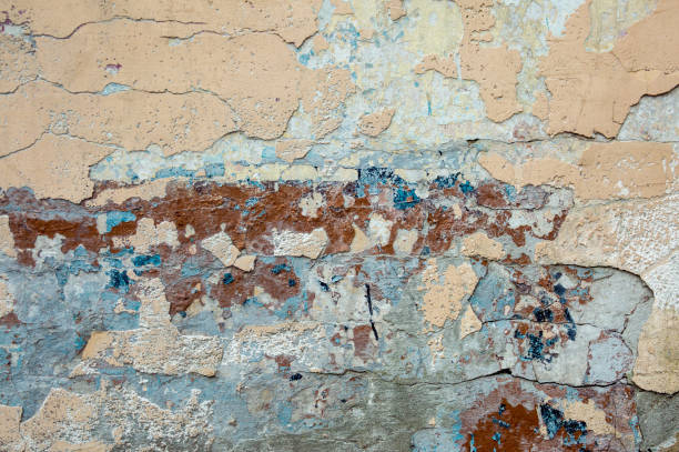 istock Texture of old stucco on a wall with paint residues with cracks. 1224402178