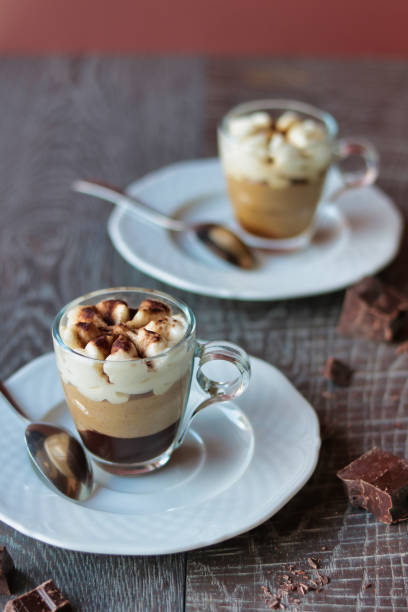 istock two cups of coffee cream decorated with chocolate 1224402436