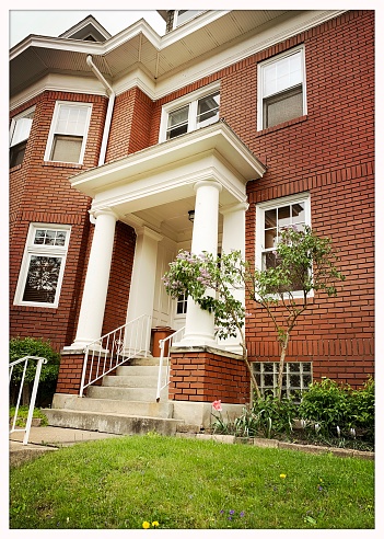 Pittsburgh, USA.   May 7, 2020\nLovely porch with columns on city house