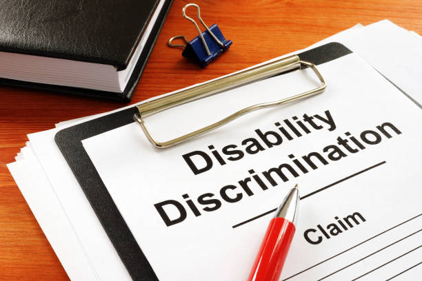 istock Disability Discrimination claim form and pen. 1224403026