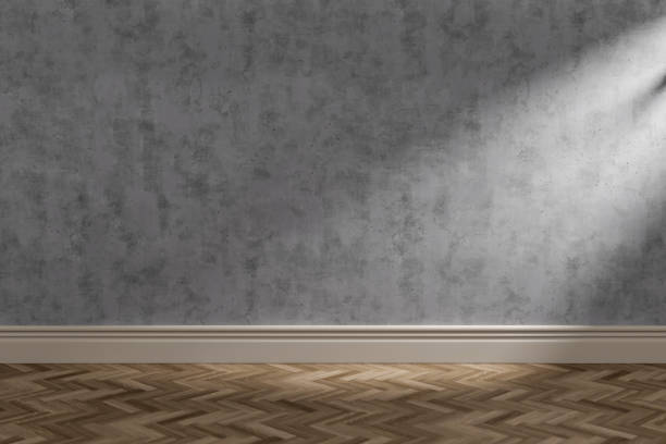 istock Sun lit interior room with concrete wall and copyspace 1224403087