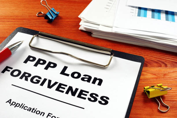 Paycheck Protection Program PPP Loan forgiveness application form. Paycheck Protection Program PPP Loan forgiveness application form. bill legislation photos stock pictures, royalty-free photos & images