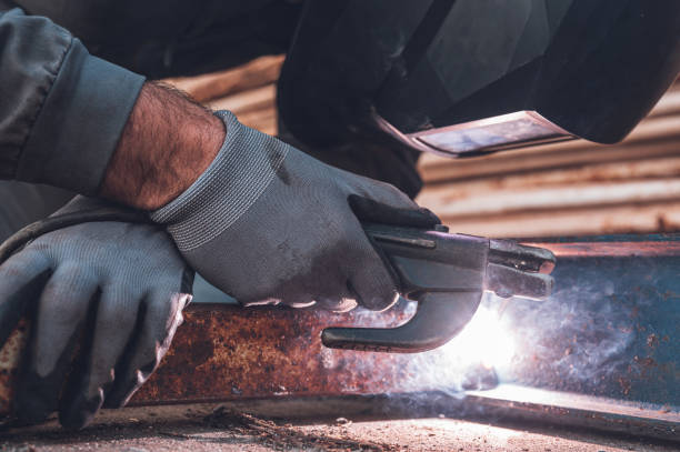 istock Welding work, Man Welding in Workshop. Metalwork and Sparks. Construction and Industrial concept. 1224404467