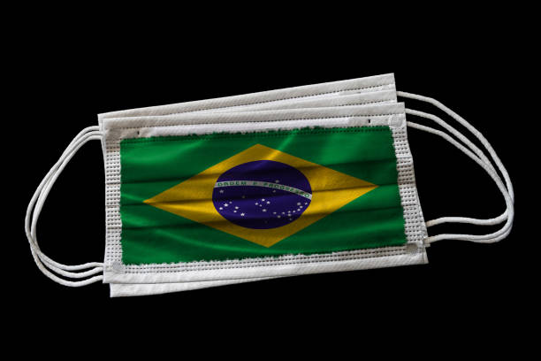 istock Surgical Masks With Brazil Flag Printed Isolated on Black Background 1224404495