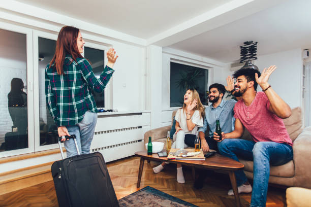 istock Student goes on a summer vacation, her friends greet her 1224405541