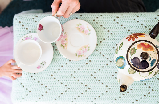 High angle view of an unrecognizable father and daughter having a tea party.