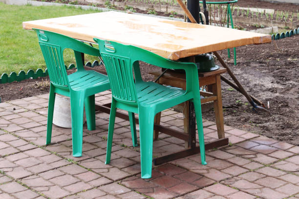 istock table and plastic green chairs in the country 1224407096
