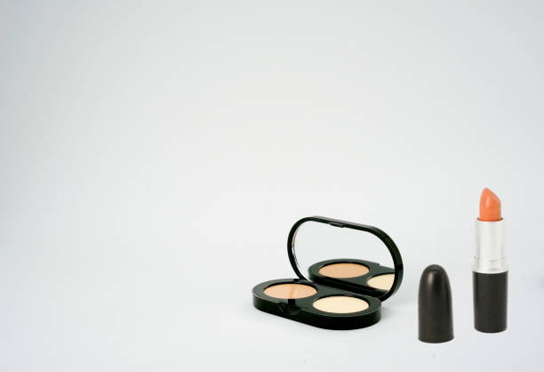 istock lipstick and pressed powder container box on isolated white background 1224407197