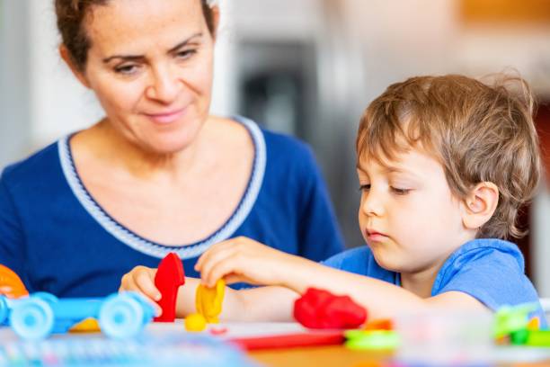 istock Child boy learning with colorful clays while locked down because pandemic 1224408805