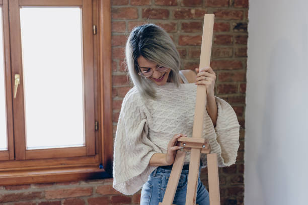 istock Girl posing with an easel in her studio 1224409046
