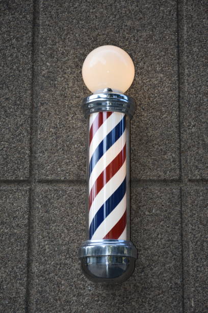 istock A barber shop pole on side of building 1224409490