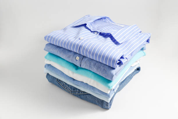 Clean garment neatly folded after laundry over bright background stock photo