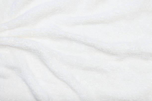 istock White beige delicate soft background of plush fabric. 1224410913