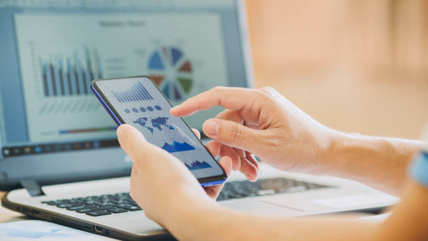 istock businessman working on project for analyzing company financial report balance statement with documents graphics at modern office space. Concept picture of business,economy, market,money and tax. 1224410933