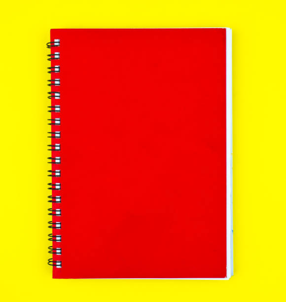 istock One red colored note paper diary placed on a isolated yellow paper background 1224413794