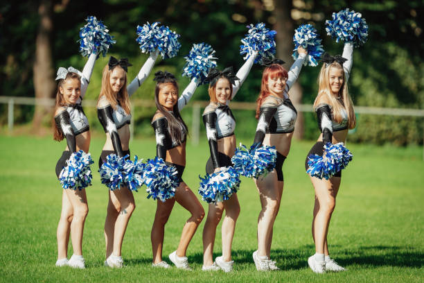 istock Cheer Line Smiling Cheerleader Group 1224413808