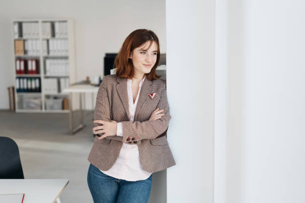 istock Relaxed trendy woman staring through a window 1224415042