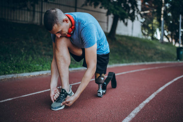 istock Man with prosthetic leg on running outdoors 1224415421