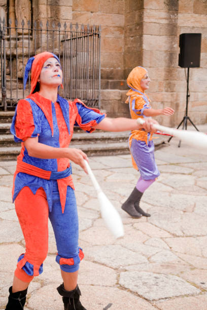 young women, street artists juggling mallets. - traditional festival juggling women performer imagens e fotografias de stock