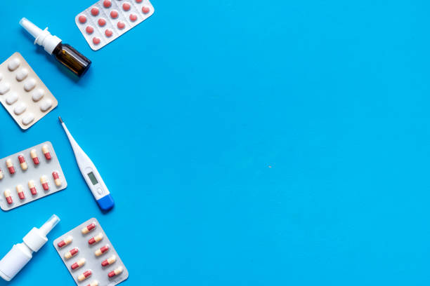 istock Pharmacy - pills, tablets - flu, cold health care. on blue background from above copy space 1224418596