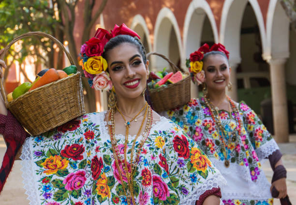 Mexican folk dancers Merida,Yucatan/Mexico-February 29,2020:female folk dancers in traditional costumes performing the fruit basket dance yucatan stock pictures, royalty-free photos & images
