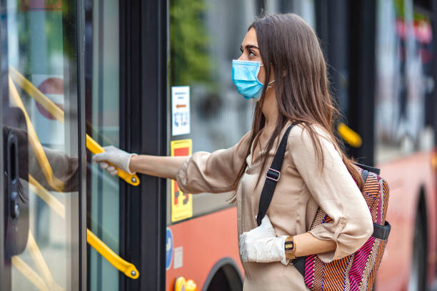 istock Woman wearing surgical protective mask going to work 1224423099