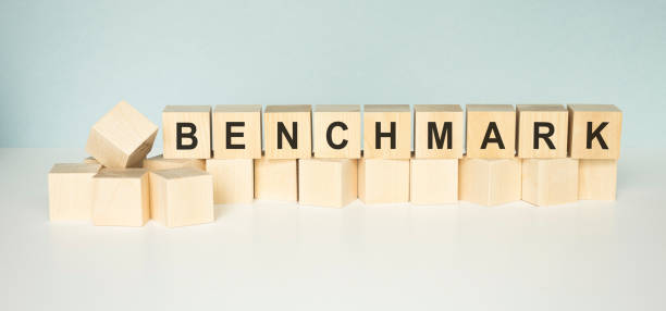 istock Benchmark word on a wooden cubes on a light background 1224424556