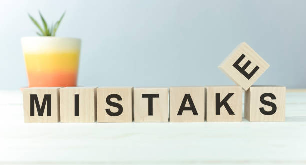 istock MISTAKES word written on wood block, on a light background 1224426740
