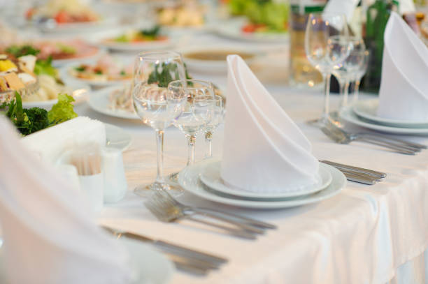 istock table set service with silverware and glass stemware at restaurant before party 1224427617