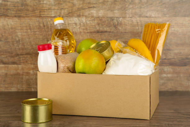 istock Donation box with food on the broun background 1224427893
