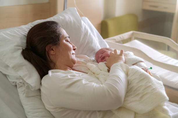 istock New born baby with his mother 1224432177