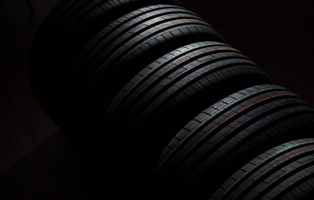 istock New tires in a row on a dark background 1224434428