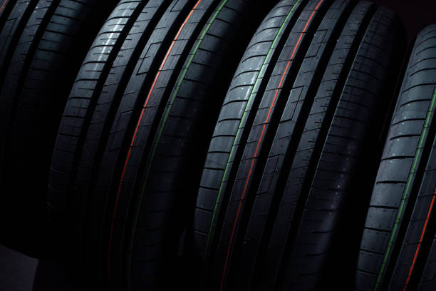 istock Set of new tires on a black background 1224434443